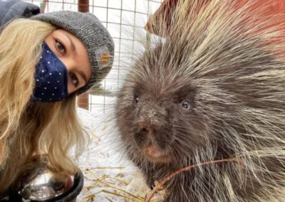 Care team member Sonia takes a selfie with a porcupine